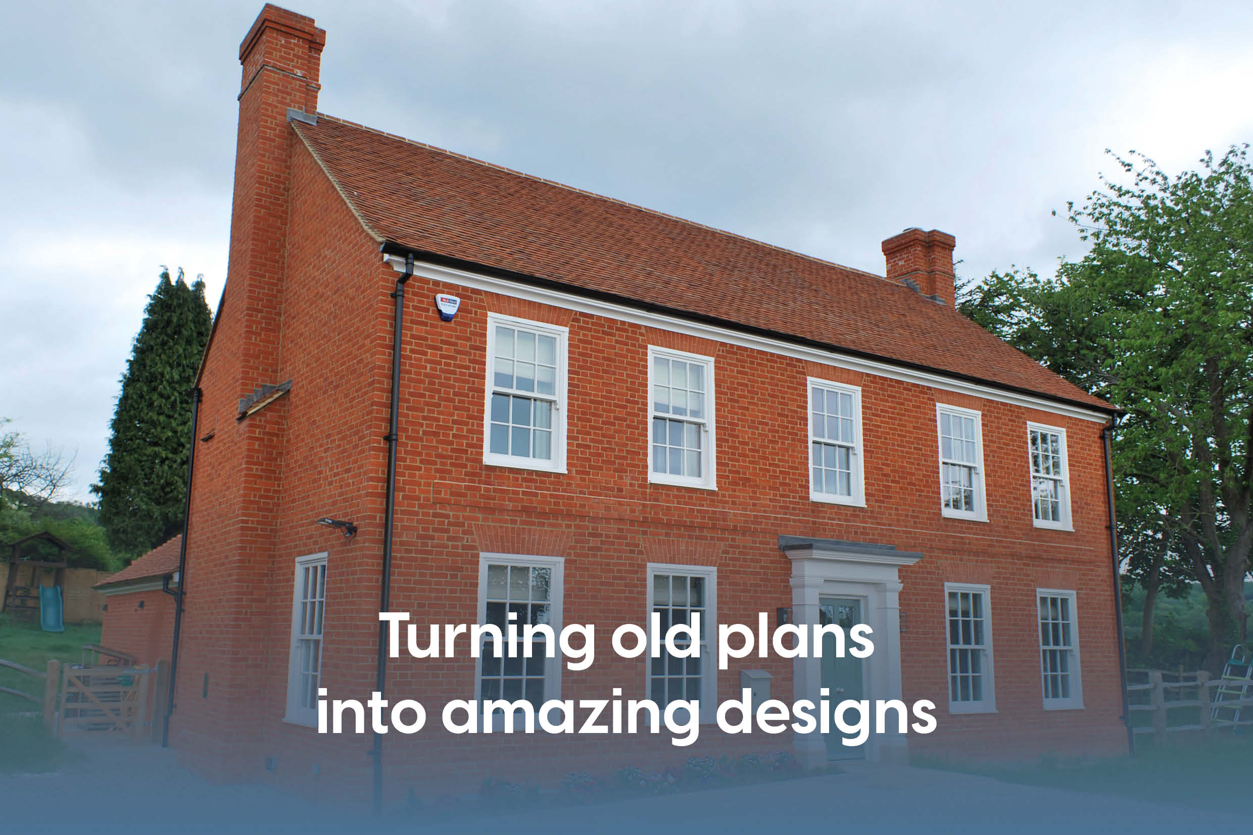 Exterior image of a beautiful double fronted new build period-style property with red brick.